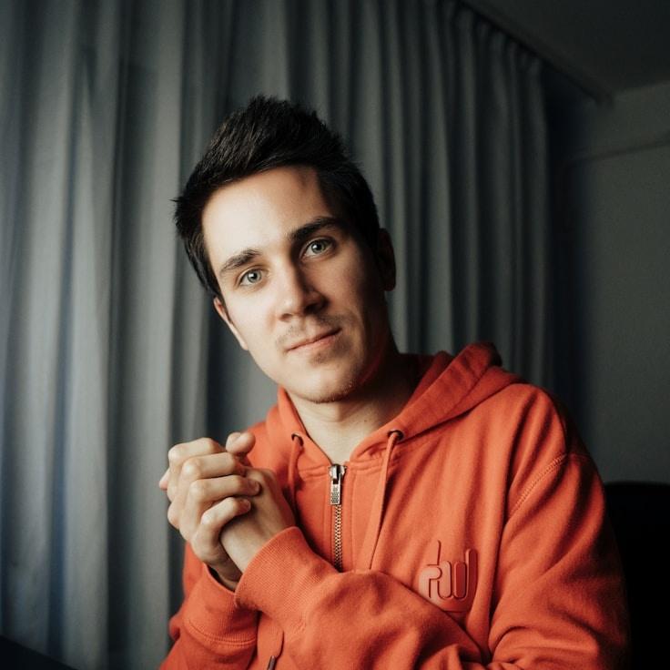 Kaveri Mehta, Lead Design Curator at QuietMarbleGrove, reviewing corporate floral arrangements